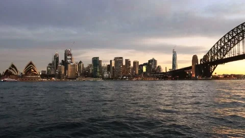 Darker time lapse sunset over Sydney city CBD landmarks and Harbour in 4k. Stock Footage 135498167