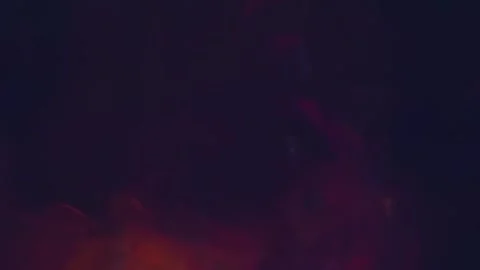 In the darkness, clouds of smoke move in a multi-colored glow Stock Footage 313146891