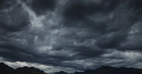 Darkness dramatic sky over the mountains, floating clouds, time lapse 4k video Stock Footage 56480793