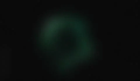 Darkness envelops the frame. Soft green glow pulses faintly. Blurry, organi.. Stock Illustration