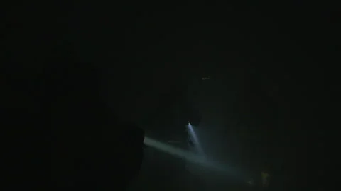 Darkness As A Flashlight Beam From Firefighters Sweeps Around The Room With Stock Footage 266414332