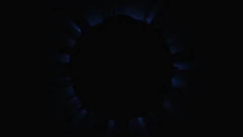 Darkness with glowing blue circular energy bursts in a scientific abstract .. Stock Footage 342520067