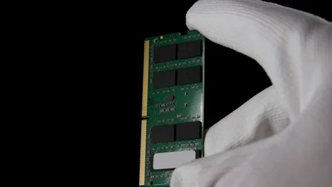 In the Darkness: Hand Securely Grasping RAM DDR4 Sodimm for PC Stock Footage 270469138
