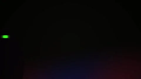 Darkness with a small green light. Stock Footage 336228200