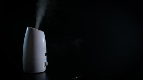 Darkness with steam from diffuser indoor. Video stock 282827762