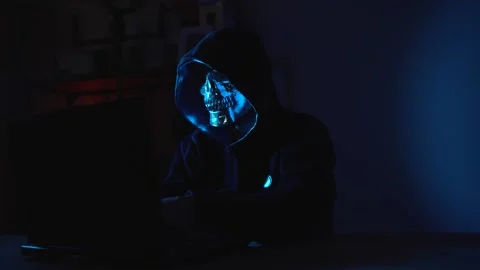 Darknet Hacker Typing in a Dim Room – Anonymous Cyber Criminal Working on Data Stock Footage 311623665