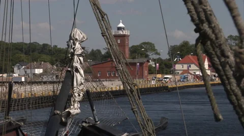 Darlowo lighthouse seen from a historic sailing ship. Stock Footage 52996331