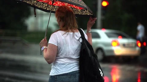 Darning woman in the rain Stock Footage 51984846