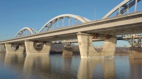 Darnitsky bridge over the Dnieper River. Ukraine city Kiev. Warm winter. Stock Footage 128230953