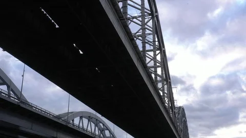 Darnitsky bridge over the Dnieper River. Ukraine city Kiev. Warm winter Stock Footage 128239228