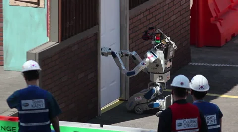DARPA Robotics Challenge DRC Hubo Robot Opening a Door Stock Footage 54987162