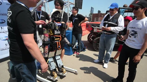 DARPA Robotics Challenge THOR Team Posing with Robot Stock-Footage 54988223
