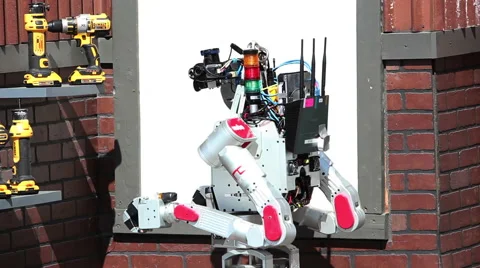 DARPA Robotics Challenge UNLV DRC-Hubo Looks over Tools Stock Footage 54986320