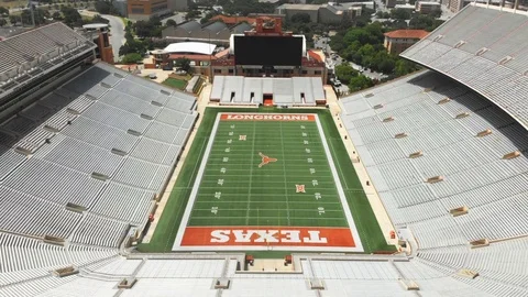 Darrell K Royal - Texas Memorial Stadium | Lowering from Stadium Stock Footage 115914561