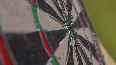 Dart arrow hitting in the target center of dartboard Stock Footage 103118804