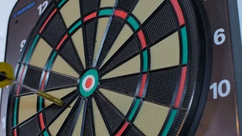 A dart arrow stick on the center of dart board. bull eye Stock Footage
