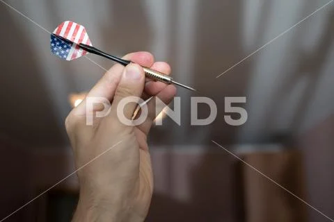 Dart in hand closeup Stock Photos