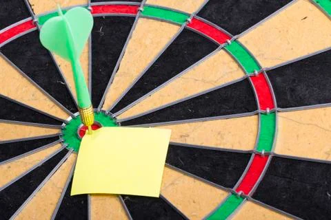 Dart hit the centre of target Stock Photos