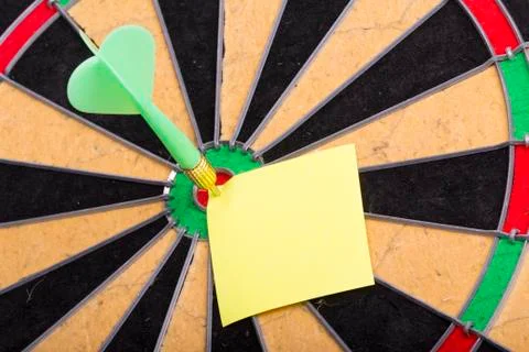 Dart hit the centre of target Stock Photos