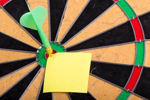 Dart hit the centre of target Stock Photos