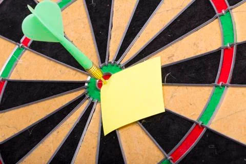 Dart hit the centre of target Stock Photos