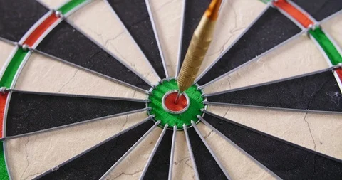 Dart Hitting Bullseye On Dartboard Stock Footage