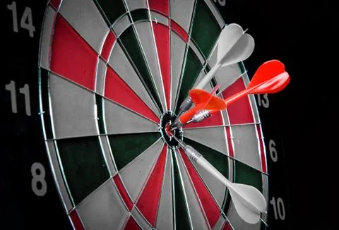 Dart hitting a target Stock Photos