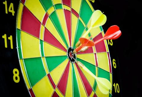 Dart hitting a target Stock Photos