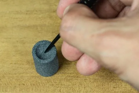 Dart pin sharpening Stock Photos