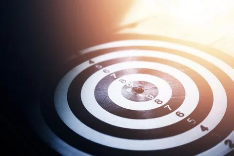Dartboard in the dark and light Stock Photos