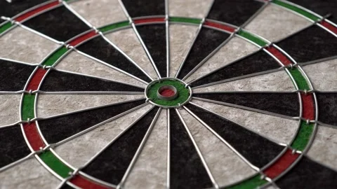 The dartboard quickly rotates 360 degrees. Close-up, angled view. Stock Footage 237873365