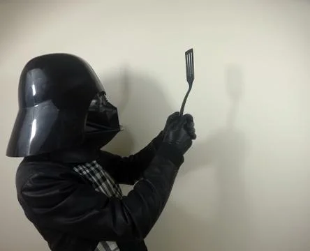 Darth Vader does things - Star Wars character Stock-Fotos