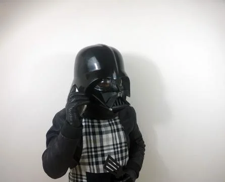 Darth Vader does things - Star Wars character Stock-Fotos