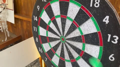 Darts that are thrown and fail to stick on the dartboard Stock Footage 276259850