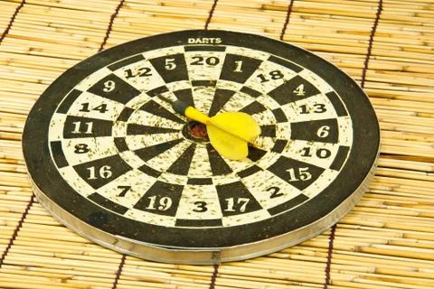 Darts on a bamboo  wall Stock Photos