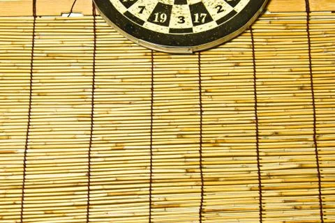 Darts on a bamboo  wall Stock Photos