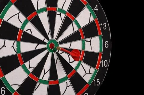 Darts on a black background Stock Photos