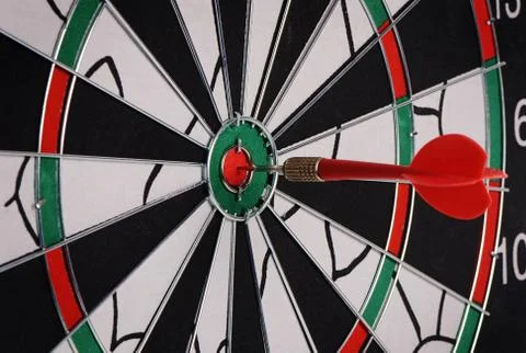 Darts on a black background Stock Photos