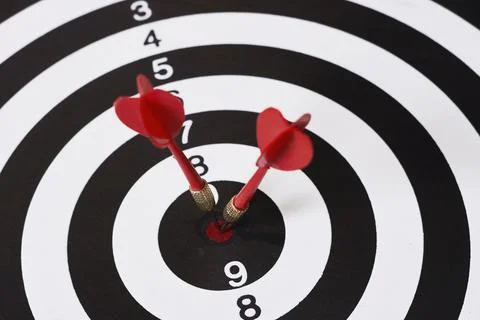 Darts in a dartboard Stock Photos