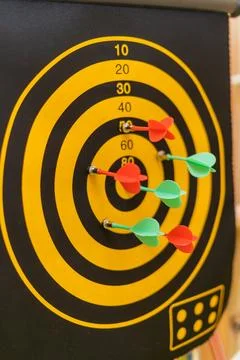 Darts game with colored darts Stock Photos