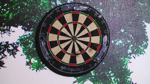 Darts hitting board missing target. darts hit the target Video stock 118930263