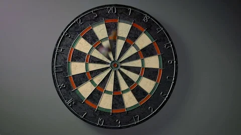 Darts Hitting Board in Slow Motion Stockbeeldmateriaal 73717459