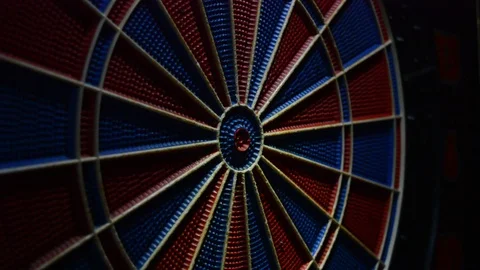 Darts hitting target, darts hitting the red center of the target Stock Footage 102525435