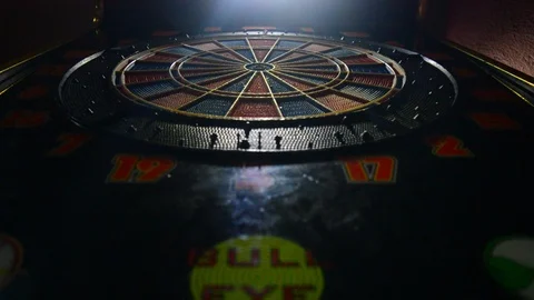 Darts hitting target, darts hitting the red center of the target Stock Footage 102525711