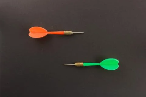 Darts needles on a black background Stock Photos