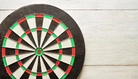 Darts or dart throwing is a competitive sport in which two or more players .. Stock Photos
