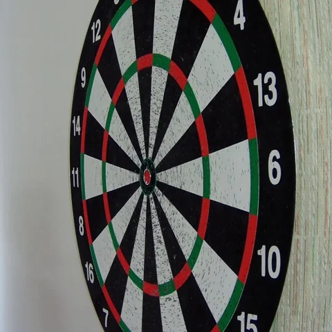 Darts stuck in the target Stock Footage 69554567