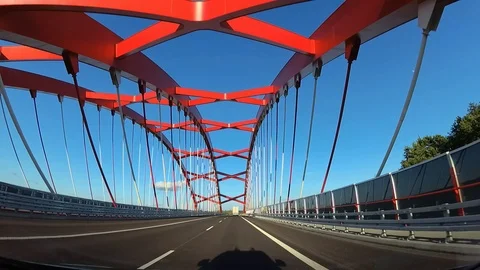 Dash Cam Driving Through Red Cable-Stayed Bridge POV, Poland Europe 動画素材 93187686