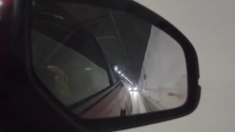 Dash Cam Driving Through Road Tunnel in Alps Side Mirror View, Italy Europe Video stock 220552307