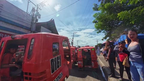 Dash Cam Rush Hour in Butuan Philippines with Passengers and Tricycles Stock Footage 325512871